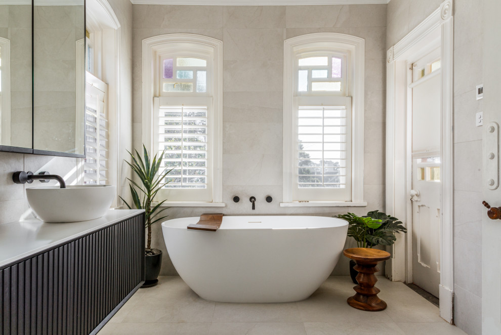 Large trendy master gray tile and porcelain tile porcelain tile, gray floor and double-sink bathroom photo in Melbourne with dark wood cabinets, a vessel sink, marble countertops, a hinged shower door, white countertops and a floating vanity