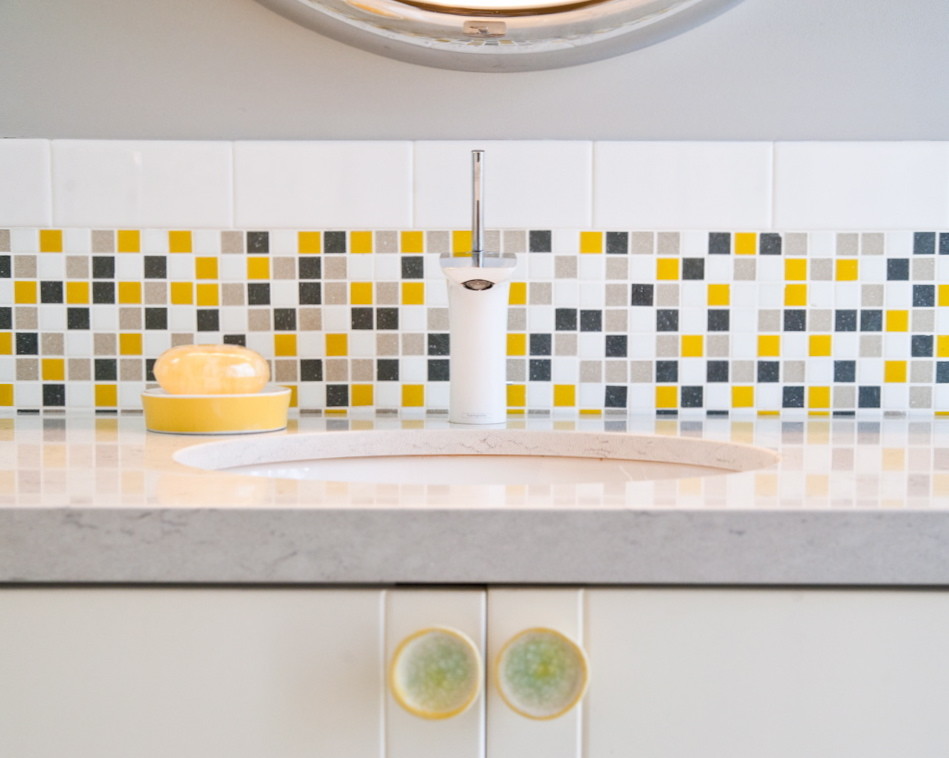 This is an example of a bohemian bathroom in Other with yellow tiles and mosaic tiles.