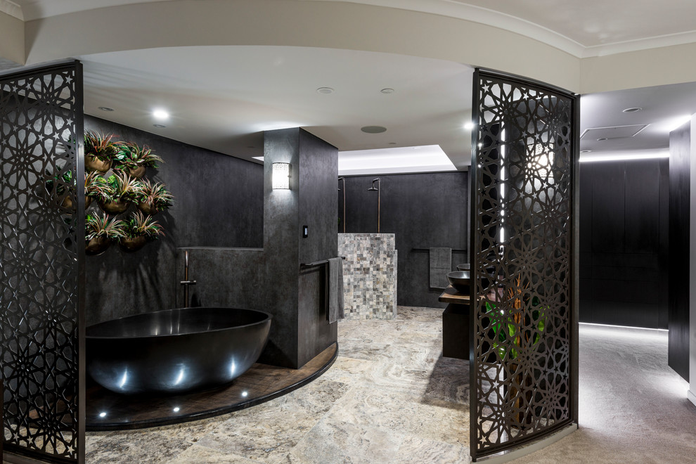 Inspiration for a large contemporary master gray tile and porcelain tile travertine floor and beige floor bathroom remodel in Brisbane with furniture-like cabinets, dark wood cabinets, a wall-mount toilet, gray walls, a vessel sink and wood countertops