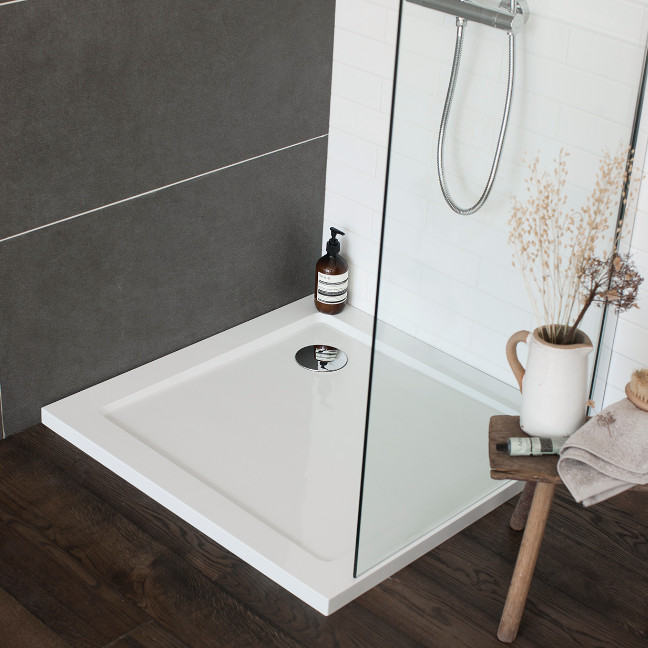 This is an example of a medium sized contemporary family bathroom in Cambridgeshire with flat-panel cabinets, white cabinets, a built-in bath, a built-in shower, a one-piece toilet, grey tiles, porcelain tiles, grey walls, marble flooring and a pedestal sink.