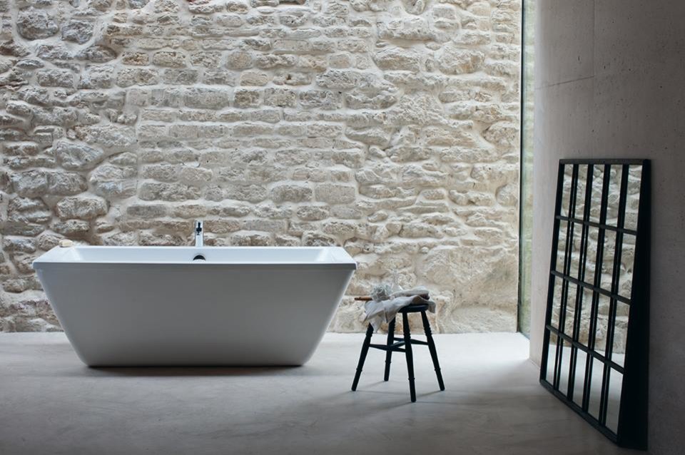 Inspiration for a medium sized contemporary family bathroom in Cambridgeshire with flat-panel cabinets, white cabinets, a built-in bath, a built-in shower, a one-piece toilet, grey tiles, porcelain tiles, grey walls, marble flooring and a pedestal sink.