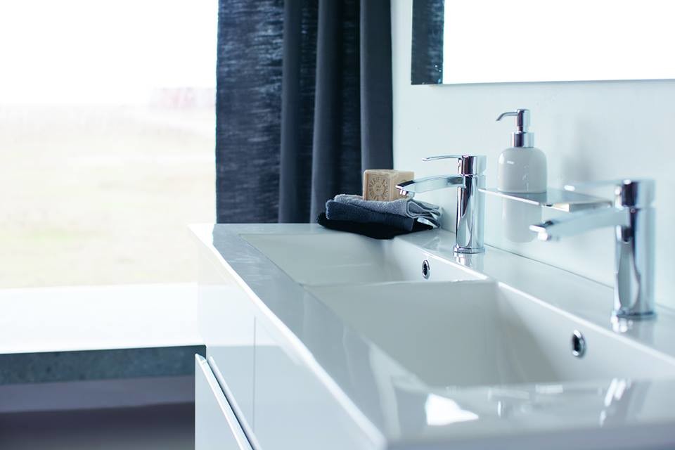 Medium sized contemporary family bathroom in Cambridgeshire with flat-panel cabinets, white cabinets, a built-in bath, a built-in shower, a one-piece toilet, grey tiles, porcelain tiles, grey walls, marble flooring and a pedestal sink.