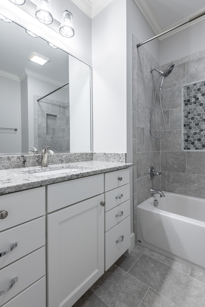 Bathroom - mid-sized craftsman 3/4 gray floor bathroom idea in Other with shaker cabinets, white cabinets, gray walls, an undermount sink and gray countertops