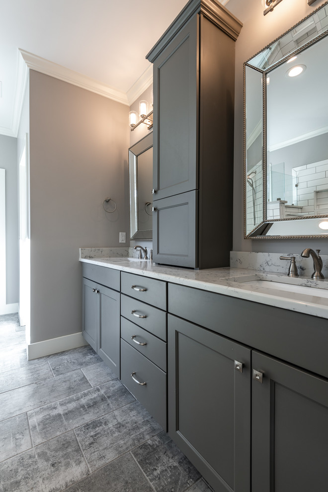 Photo of a medium sized classic ensuite bathroom in Other with shaker cabinets, grey cabinets, a freestanding bath, grey walls, a submerged sink, a hinged door, quartz worktops and white worktops.