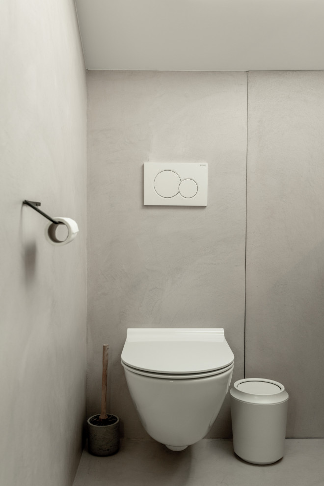Diseño de cuarto de baño principal moderno pequeño con armarios con rebordes decorativos, puertas de armario de madera oscura, encimera de cemento y encimeras rosas