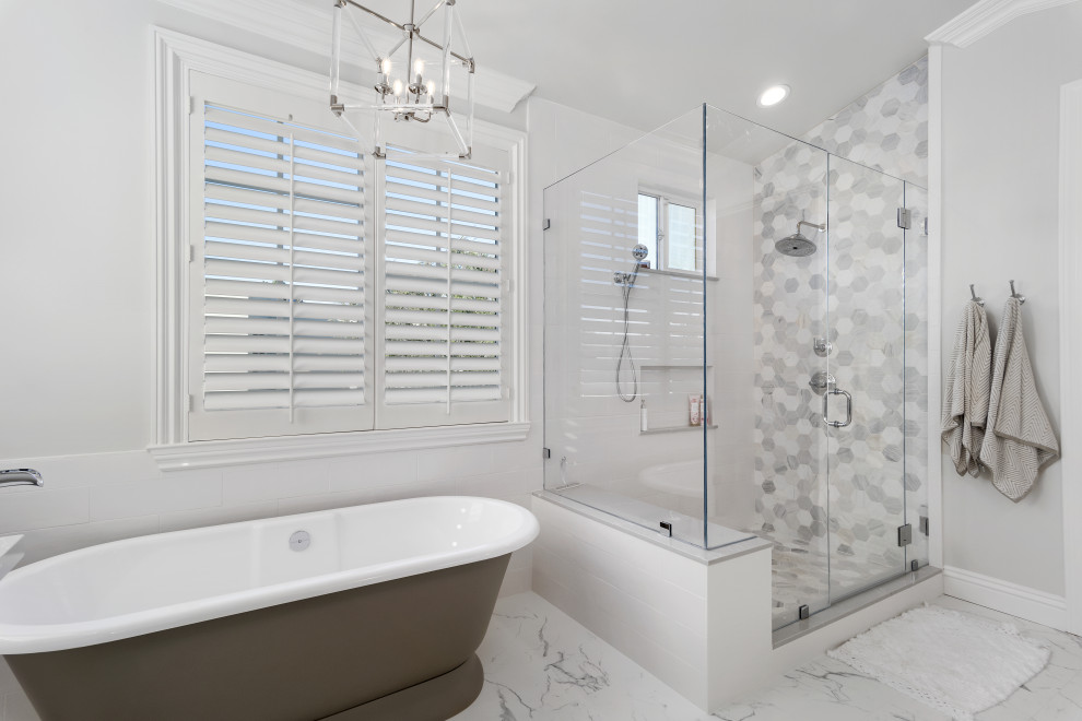 This is an example of a small nautical ensuite bathroom in Orange County with recessed-panel cabinets, light wood cabinets, a freestanding bath, an alcove shower, a one-piece toilet, white tiles, ceramic tiles, white walls, ceramic flooring, a submerged sink, granite worktops, white floors, a hinged door, white worktops, a shower bench, a single sink and a freestanding vanity unit.
