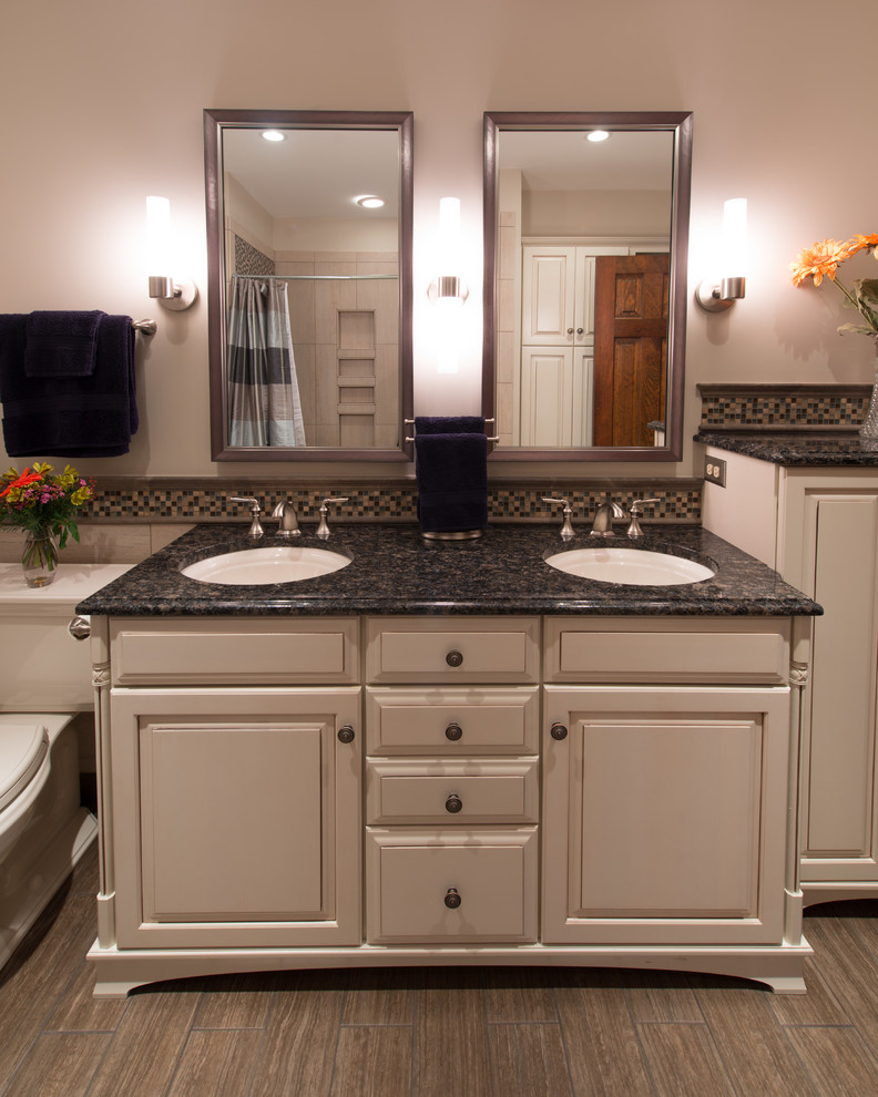 Mid-sized transitional kids' beige tile and mosaic tile porcelain tile bathroom photo in Richmond with an undermount sink, recessed-panel cabinets, granite countertops, a two-piece toilet and beige walls