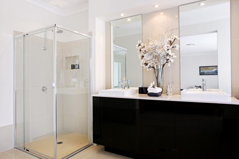 Photo of a large contemporary ensuite bathroom in Newcastle - Maitland with flat-panel cabinets, black cabinets, a built-in bath, a corner shower, a one-piece toilet, grey walls, a built-in sink, engineered stone worktops, a hinged door, beige tiles and beige floors.
