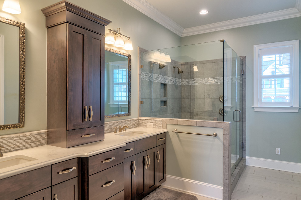 Inspiration for a mid-sized transitional master blue tile and ceramic tile ceramic tile and beige floor bathroom remodel in Other with recessed-panel cabinets, gray cabinets, blue walls, a drop-in sink, quartzite countertops, a hinged shower door and white countertops