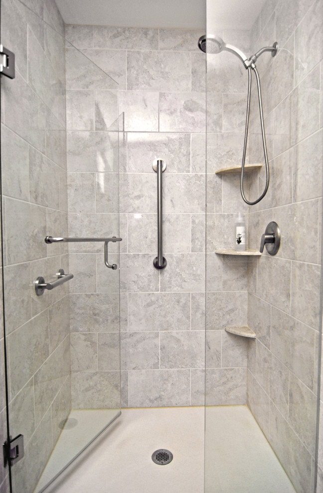 Alcove shower - mid-sized contemporary master ceramic tile alcove shower idea in Milwaukee with shaker cabinets, brown cabinets, a two-piece toilet, beige walls, an undermount sink and quartzite countertops