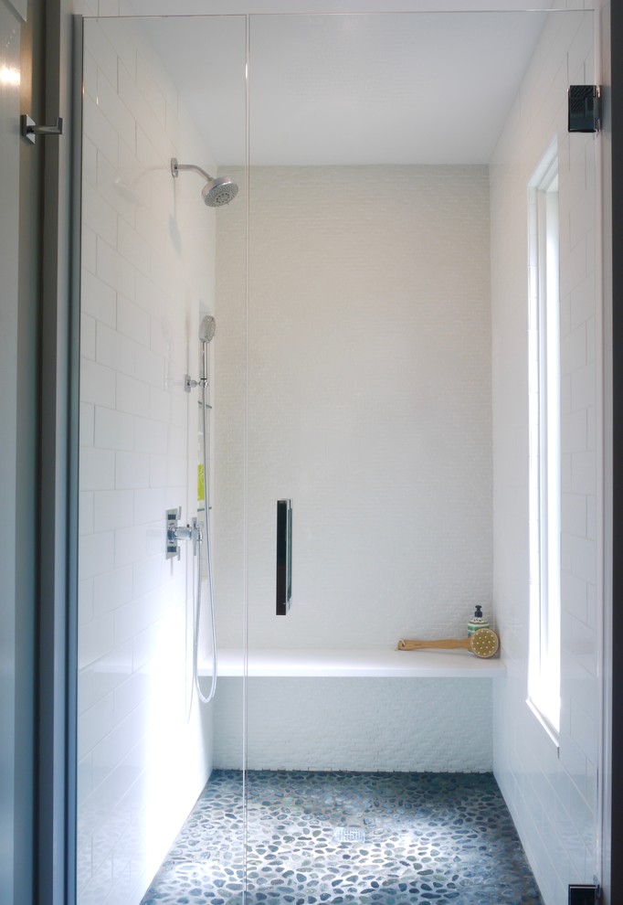 Medium sized classic ensuite bathroom in Boston with flat-panel cabinets, medium wood cabinets, an alcove shower, a two-piece toilet, white tiles, porcelain tiles, beige walls, porcelain flooring, a submerged sink, engineered stone worktops, grey floors, a hinged door and grey worktops.