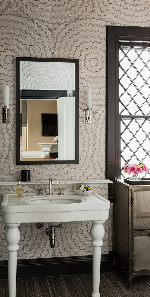 Example of a mid-sized transitional bathroom design in Boston with a console sink, glass-front cabinets and multicolored walls
