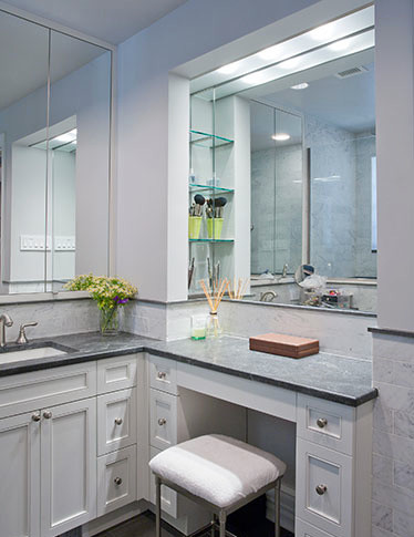Inspiration for an eclectic 3/4 multicolored tile and ceramic tile ceramic tile bathroom remodel in New York with a drop-in sink, recessed-panel cabinets, white cabinets and white walls