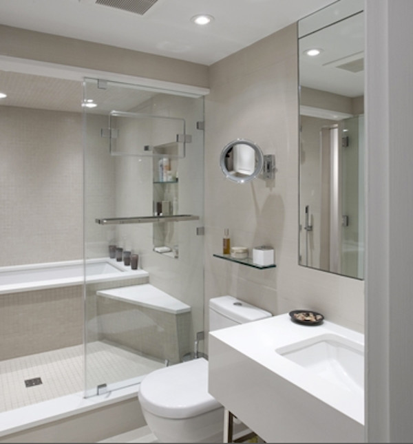 Example of a mid-sized minimalist beige tile corner bathtub design in New York with a hinged shower door
