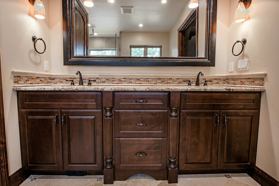 Photo of a medium sized classic ensuite bathroom in Denver with raised-panel cabinets, brown cabinets, beige tiles, ceramic tiles, beige walls, ceramic flooring and granite worktops.