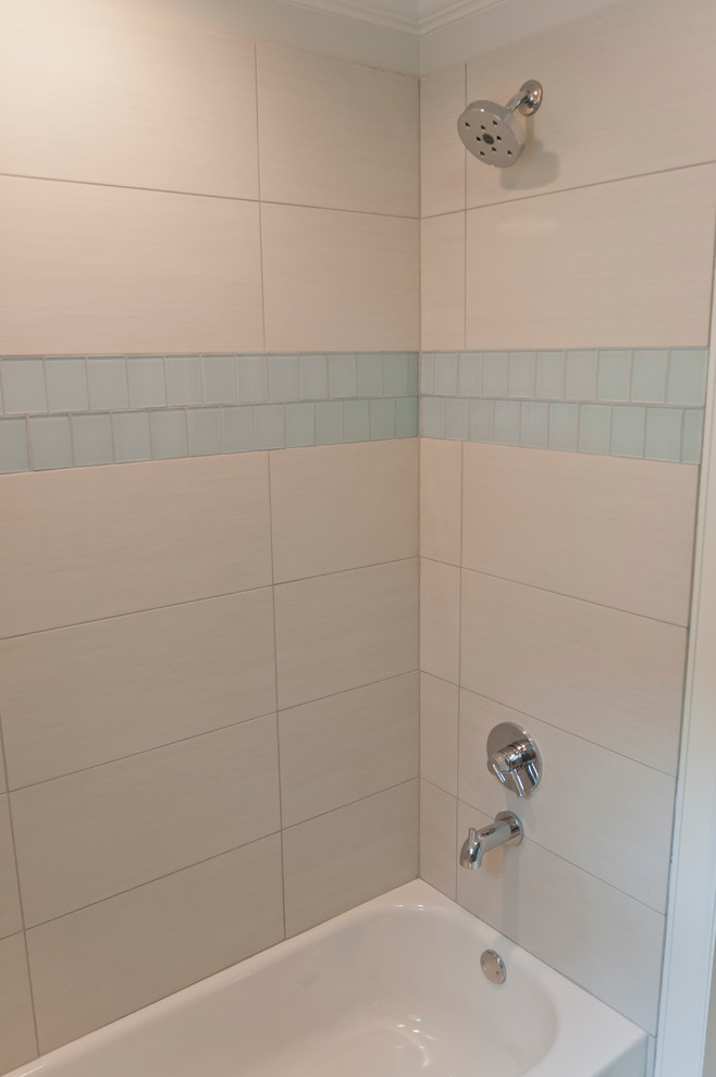 Example of a mid-sized island style kids' multicolored tile and porcelain tile porcelain tile alcove bathtub design in Houston with an undermount sink, recessed-panel cabinets, blue cabinets, granite countertops and white walls