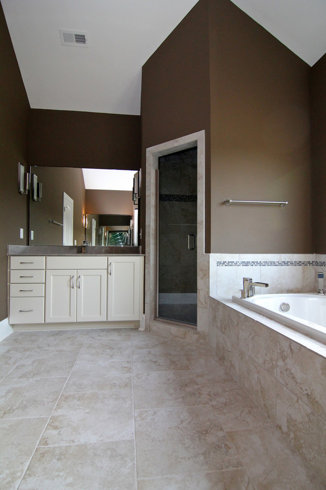 Large elegant master beige tile and ceramic tile ceramic tile bathroom photo in Raleigh with an integrated sink, recessed-panel cabinets, white cabinets, a one-piece toilet and brown walls