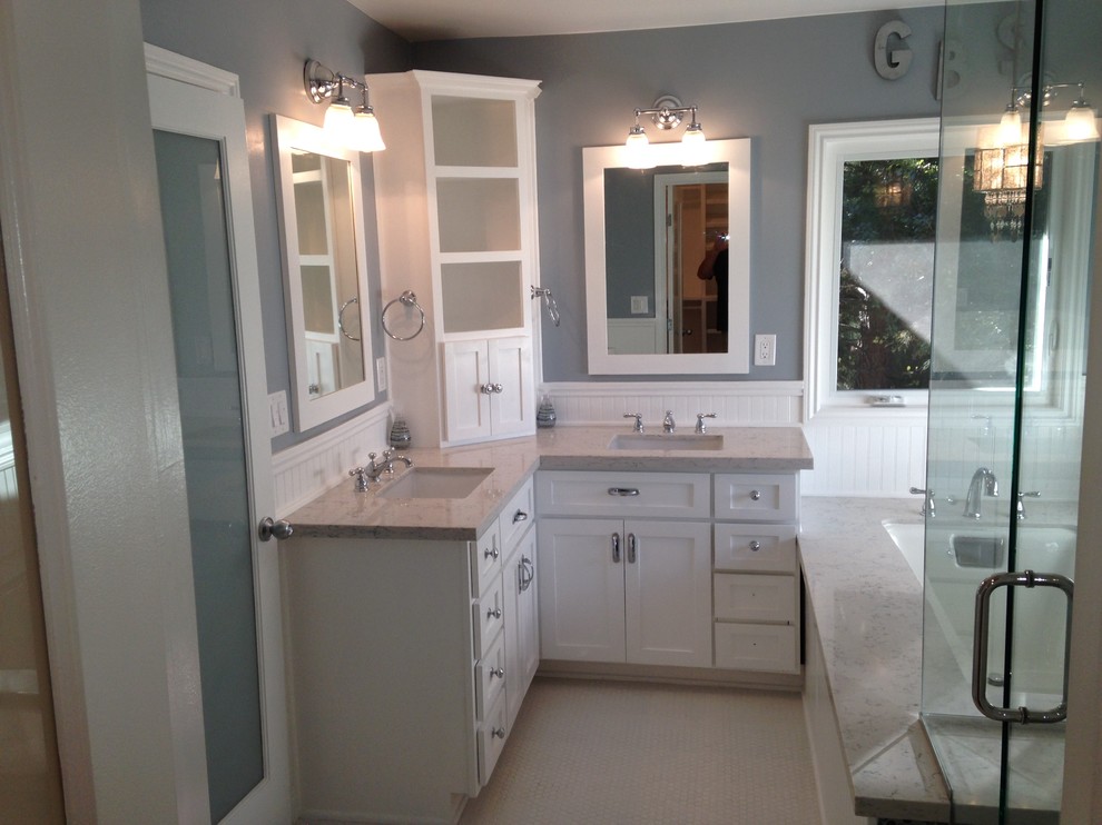 Photo of a medium sized contemporary ensuite bathroom in Orange County with shaker cabinets, white cabinets, quartz worktops, a submerged bath, white tiles, metro tiles, a submerged sink and mosaic tile flooring.