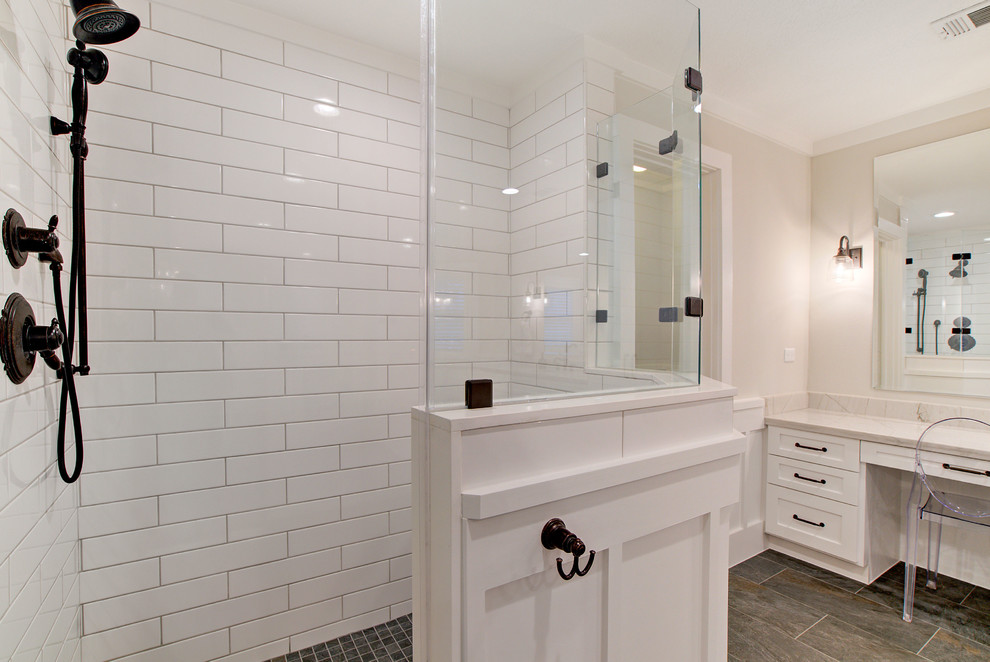 Inspiration for a farmhouse master white tile and ceramic tile porcelain tile and gray floor bathroom remodel in Houston with shaker cabinets, white cabinets, a one-piece toilet, white walls, an undermount sink, quartzite countertops, a hinged shower door and white countertops