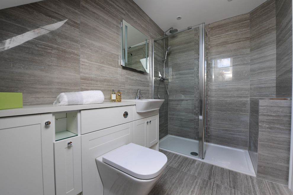 Inspiration for a contemporary bathroom in London with brown tiles, porcelain tiles, porcelain flooring and brown floors.