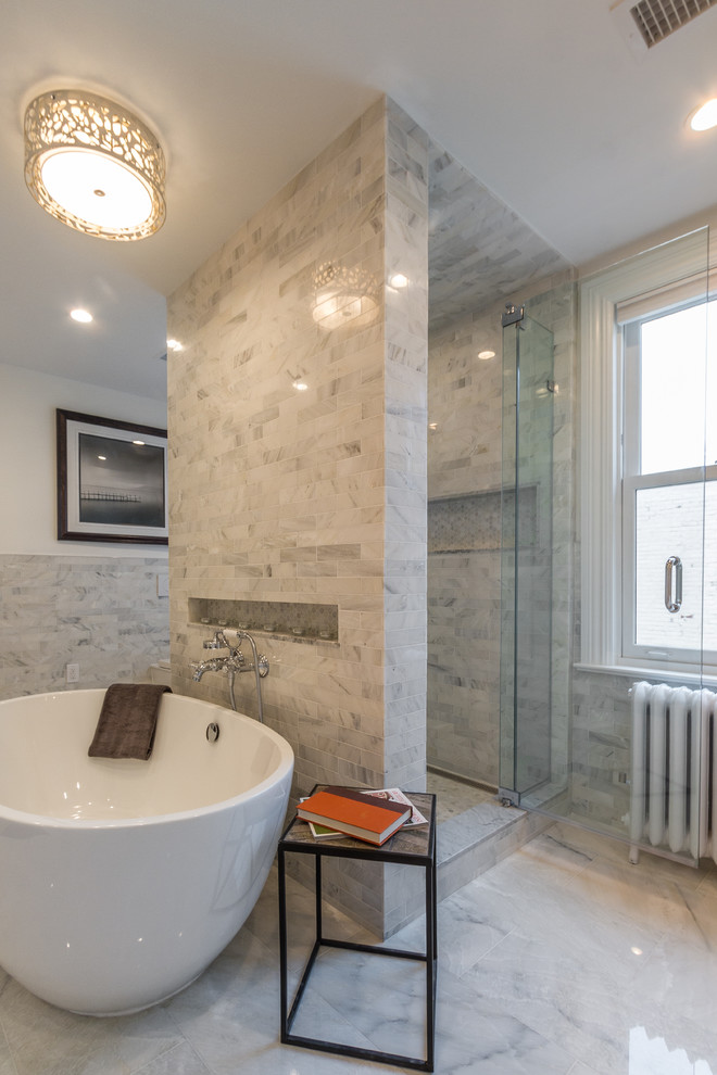 Inspiration for a medium sized traditional ensuite wet room bathroom in New York with a freestanding bath, grey tiles, marble tiles, white walls, marble flooring, grey floors and a hinged door.