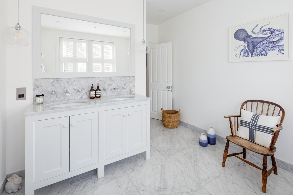 Photo of a medium sized traditional family bathroom in London with a freestanding bath, white walls, marble flooring and grey floors.