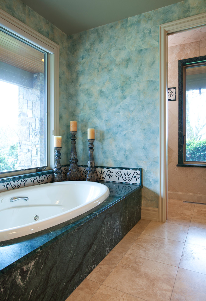 Design ideas for a large mediterranean ensuite bathroom in Portland with a built-in bath, beige tiles, green tiles, mosaic tiles, green walls, marble flooring and brown floors.