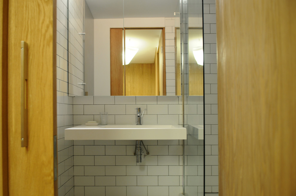 Photo of a modern bathroom in London with metro tiles.