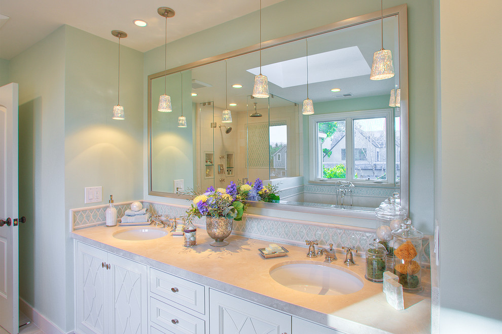Example of a large transitional master beige tile and matchstick tile ceramic tile bathroom design in San Francisco with an undermount sink, beaded inset cabinets, white cabinets, limestone countertops, a one-piece toilet and green walls