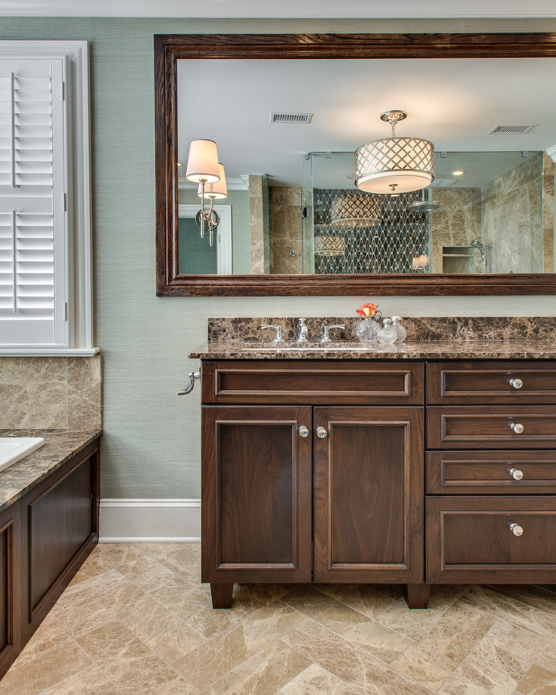 This is an example of a large traditional ensuite bathroom in Chicago with dark wood cabinets, a built-in bath, a double shower, a two-piece toilet, blue walls, marble flooring, a submerged sink and marble worktops.