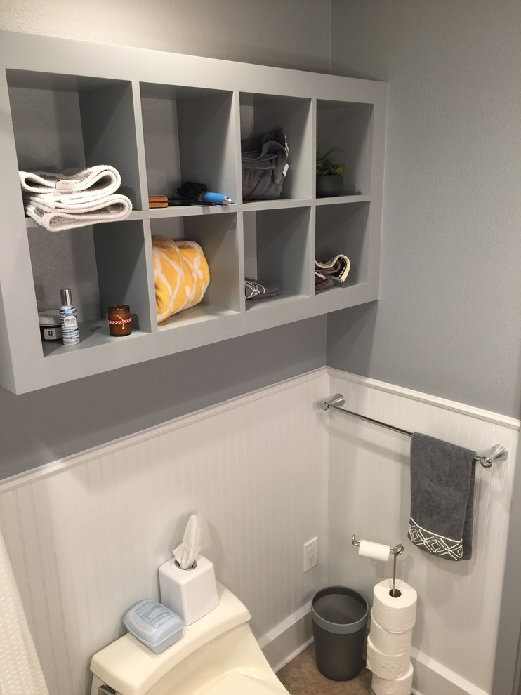 Design ideas for a small traditional ensuite bathroom in Dallas with recessed-panel cabinets, grey cabinets, an alcove bath, a shower/bath combination, a one-piece toilet, grey tiles, ceramic tiles, grey walls, ceramic flooring and a pedestal sink.