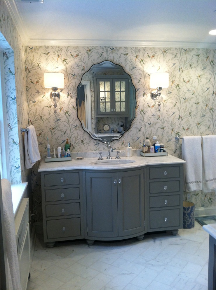 This is an example of a medium sized traditional ensuite bathroom in Philadelphia with a submerged sink, beaded cabinets, grey cabinets, marble worktops, a corner shower, a two-piece toilet, white tiles, stone tiles, multi-coloured walls and marble flooring.