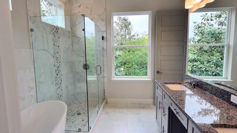 Bathroom - mid-sized contemporary master white tile and marble tile marble floor and white floor bathroom idea with recessed-panel cabinets, gray cabinets, a one-piece toilet, white walls, an undermount sink, granite countertops and gray countertops