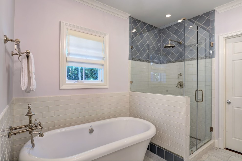 Photo of a classic half tiled bathroom in Atlanta with a freestanding bath.