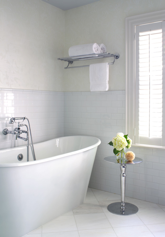 Inspiration for a traditional bathroom in Toronto with a freestanding bath, white tiles, metro tiles and white floors.