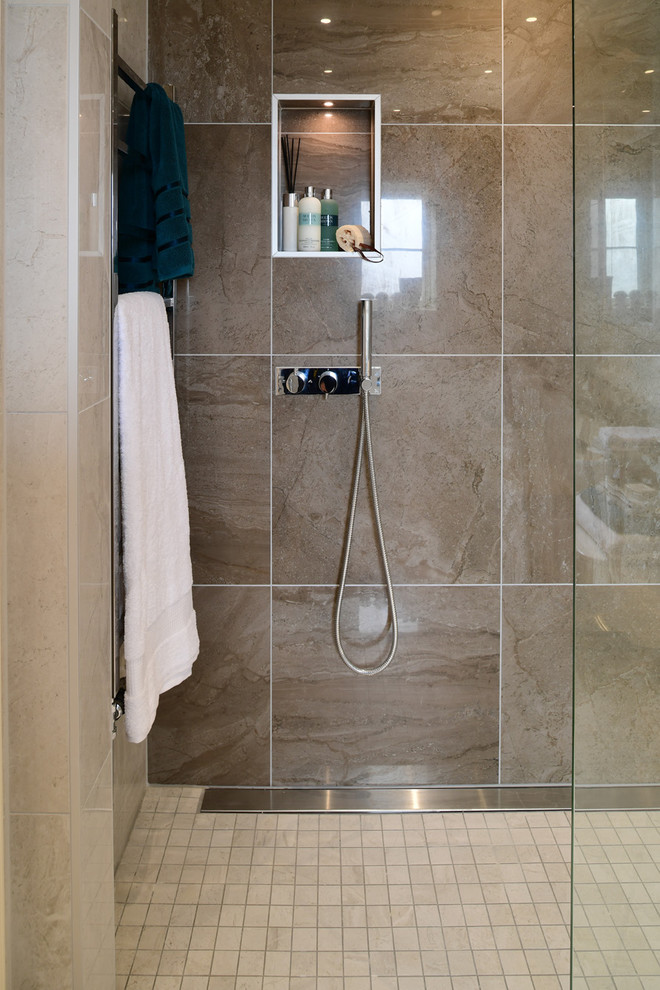 Inspiration for a contemporary brown tile and porcelain tile porcelain tile and beige floor bathroom remodel in London