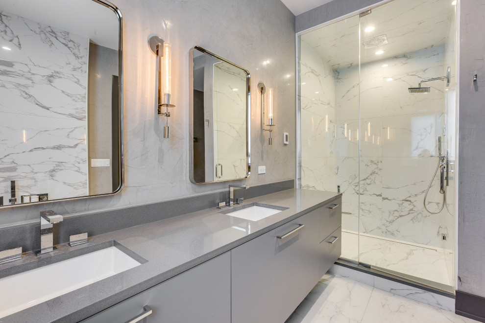 Contemporary ensuite bathroom in Chicago with flat-panel cabinets, grey cabinets, an alcove shower, grey tiles, white tiles, a submerged sink, multi-coloured floors, a hinged door, grey worktops, double sinks and a floating vanity unit.