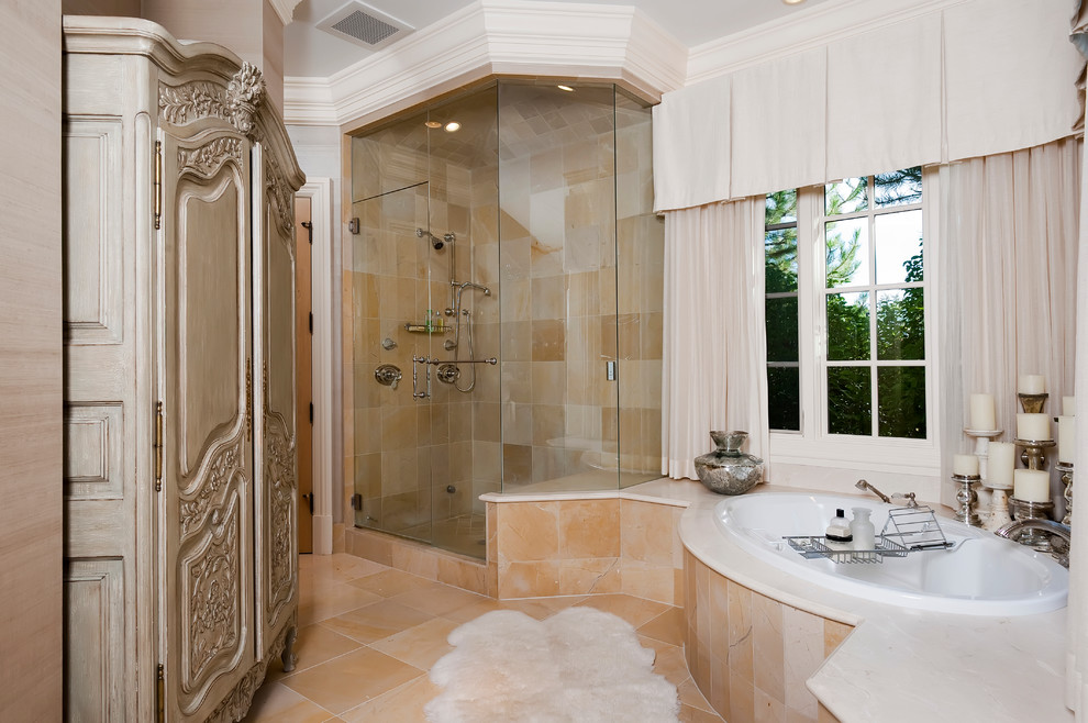 Example of a huge transitional master beige tile and stone tile limestone floor bathroom design in Denver with beaded inset cabinets, beige cabinets, a bidet, beige walls, a drop-in sink and marble countertops