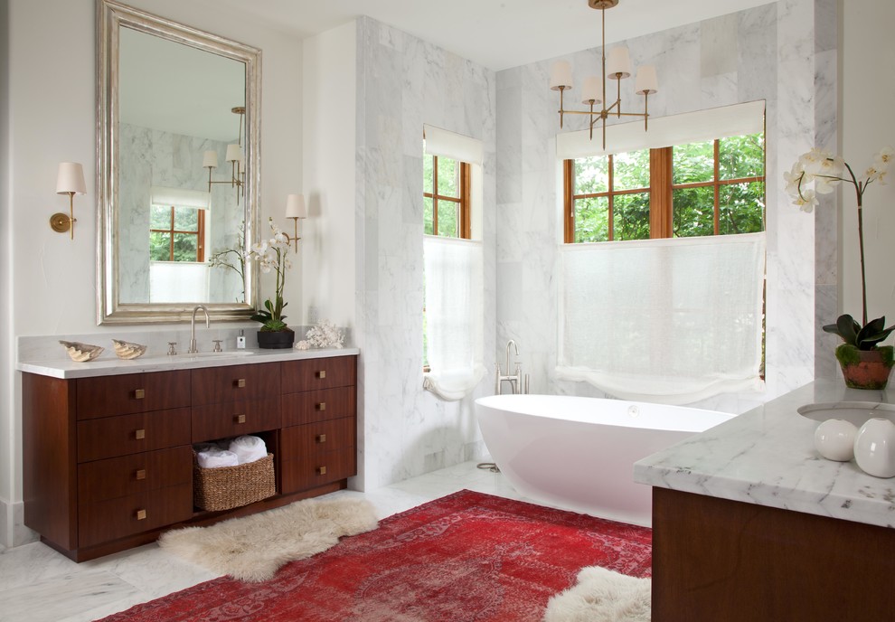 Photo of a classic ensuite bathroom in Denver with dark wood cabinets and a freestanding bath.