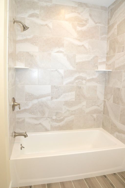 Example of a mid-sized transitional master ceramic tile and gray floor bathroom design in New York with shaker cabinets and white cabinets