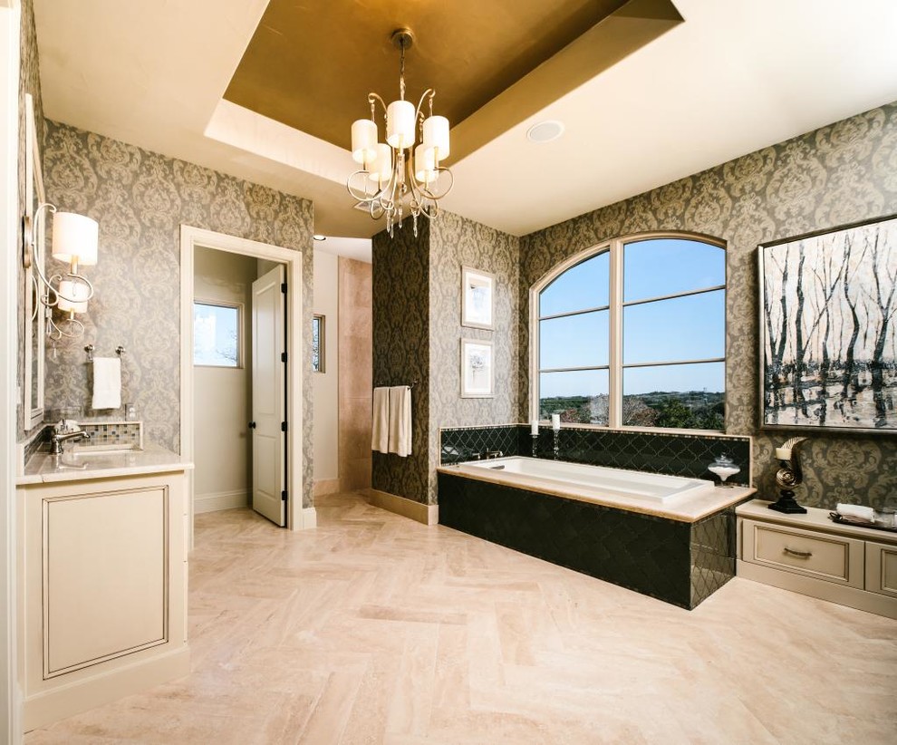 This is an example of a traditional bathroom in Austin with a submerged sink, recessed-panel cabinets, distressed cabinets, marble worktops, a built-in bath, a built-in shower, beige tiles, mosaic tiles, beige walls and ceramic flooring.