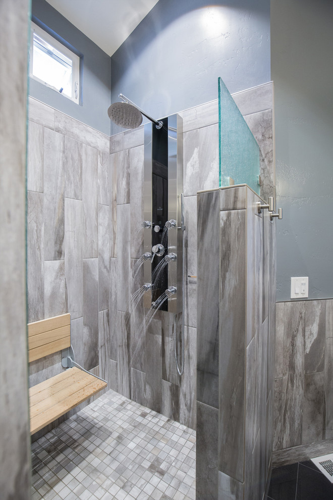 Inspiration for a small modern ensuite bathroom in San Diego with a submerged sink, recessed-panel cabinets, dark wood cabinets, granite worktops, a double shower, grey tiles, ceramic tiles, blue walls and ceramic flooring.