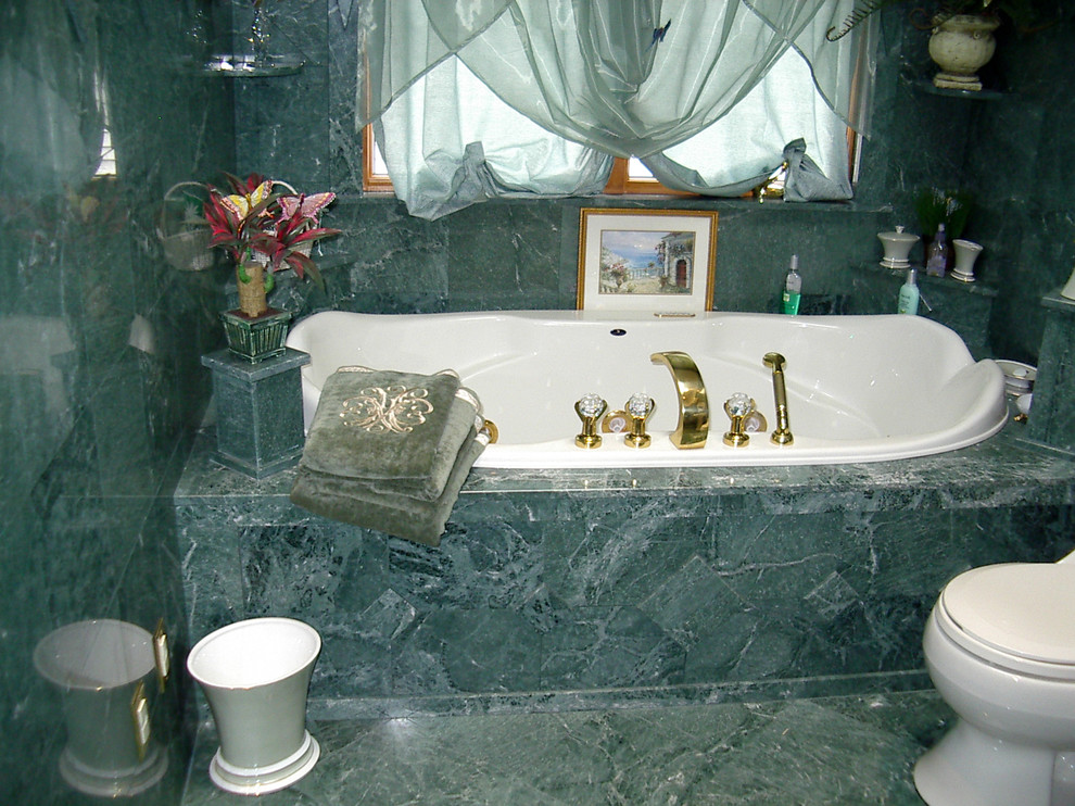 Mid-sized elegant master green tile drop-in bathtub photo in New York