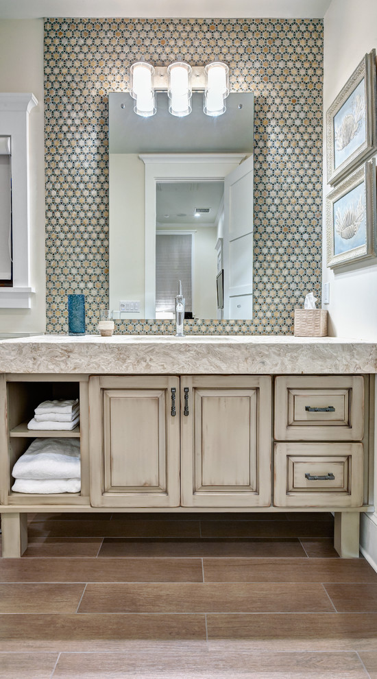 This is an example of a world-inspired bathroom in Miami with mosaic tiles.