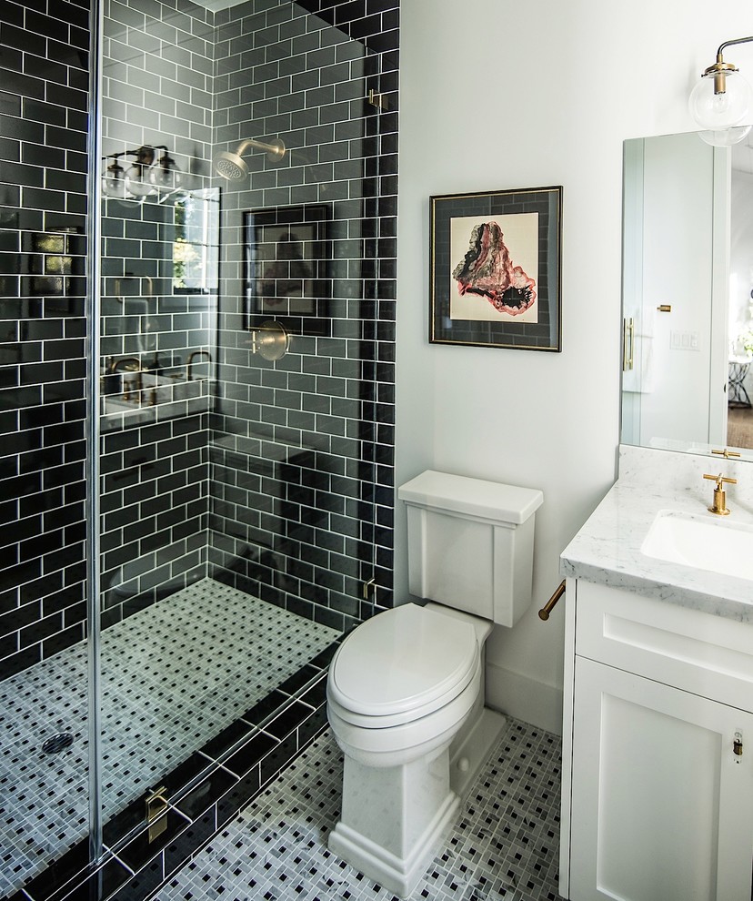 This is an example of a medium sized traditional shower room bathroom in Los Angeles with white cabinets, an alcove shower, a one-piece toilet, black tiles, ceramic tiles, white walls and ceramic flooring.
