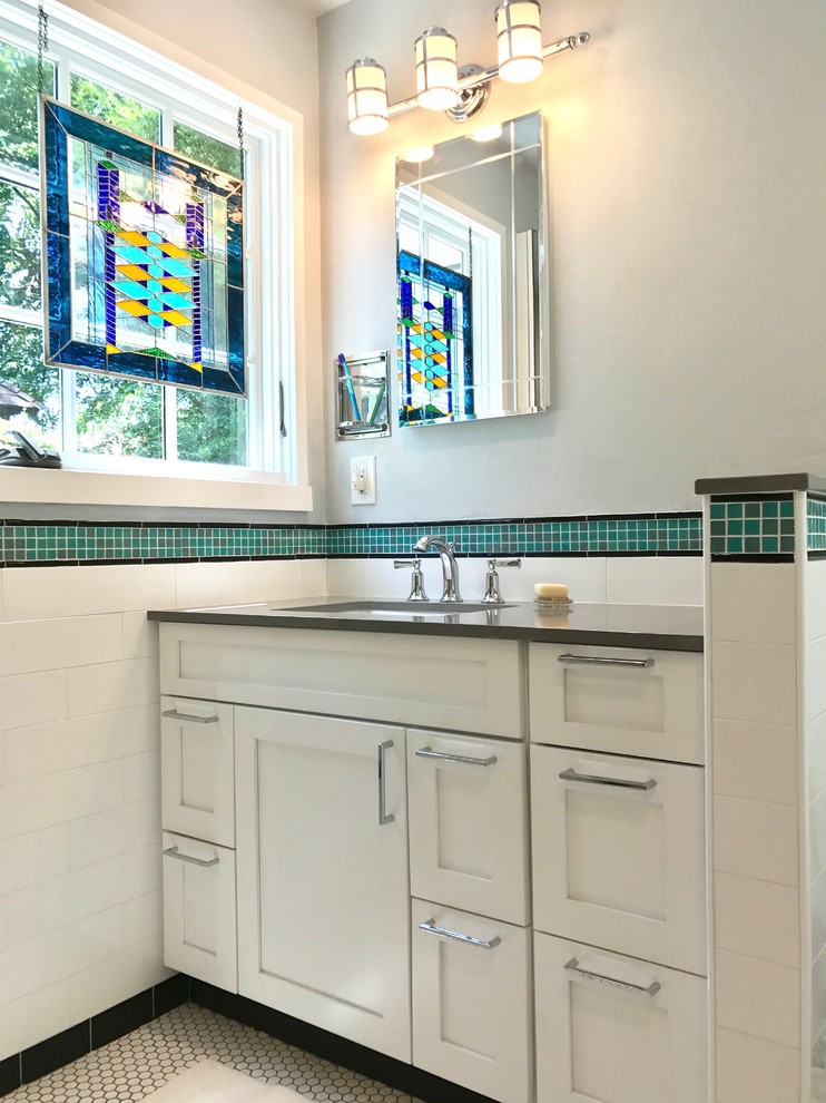 This is an example of a small classic bathroom in Oklahoma City with shaker cabinets, white cabinets, a one-piece toilet, white tiles, ceramic tiles, grey walls, ceramic flooring, a submerged sink, engineered stone worktops, white floors and an open shower.