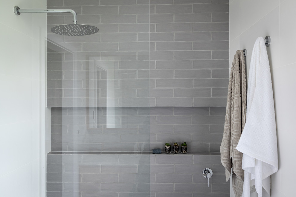Inspiration for a contemporary ensuite bathroom in Sydney with a walk-in shower, grey tiles, metro tiles, cement flooring, multi-coloured floors, an open shower and grey walls.