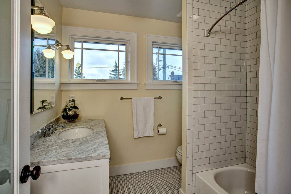 Bathroom - mid-sized traditional white tile and ceramic tile ceramic tile bathroom idea in Seattle with white cabinets, yellow walls, an undermount sink and marble countertops