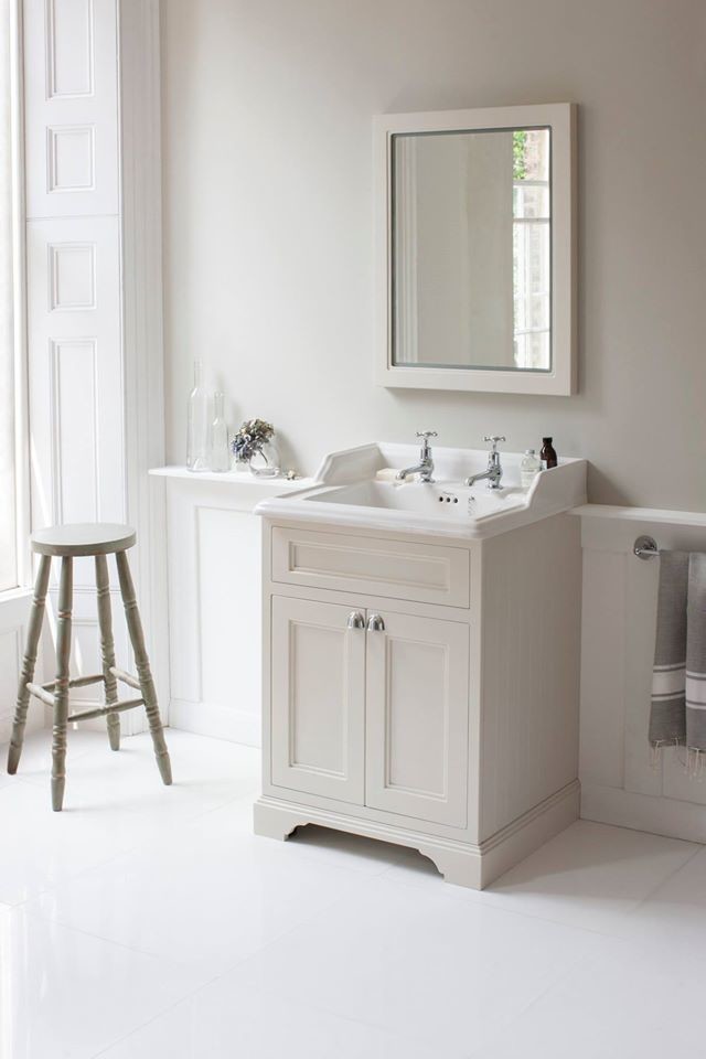 This is an example of a medium sized classic family bathroom in Cambridgeshire with shaker cabinets, medium wood cabinets, a claw-foot bath, a built-in shower, a one-piece toilet, white tiles, ceramic tiles, white walls, porcelain flooring, a pedestal sink and marble worktops.