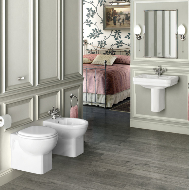 Medium sized classic family bathroom in Cambridgeshire with shaker cabinets, medium wood cabinets, a claw-foot bath, a built-in shower, a one-piece toilet, white tiles, ceramic tiles, white walls, porcelain flooring, a pedestal sink and marble worktops.
